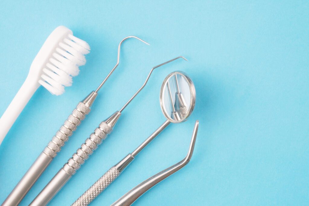 Dental tools on a blue background.